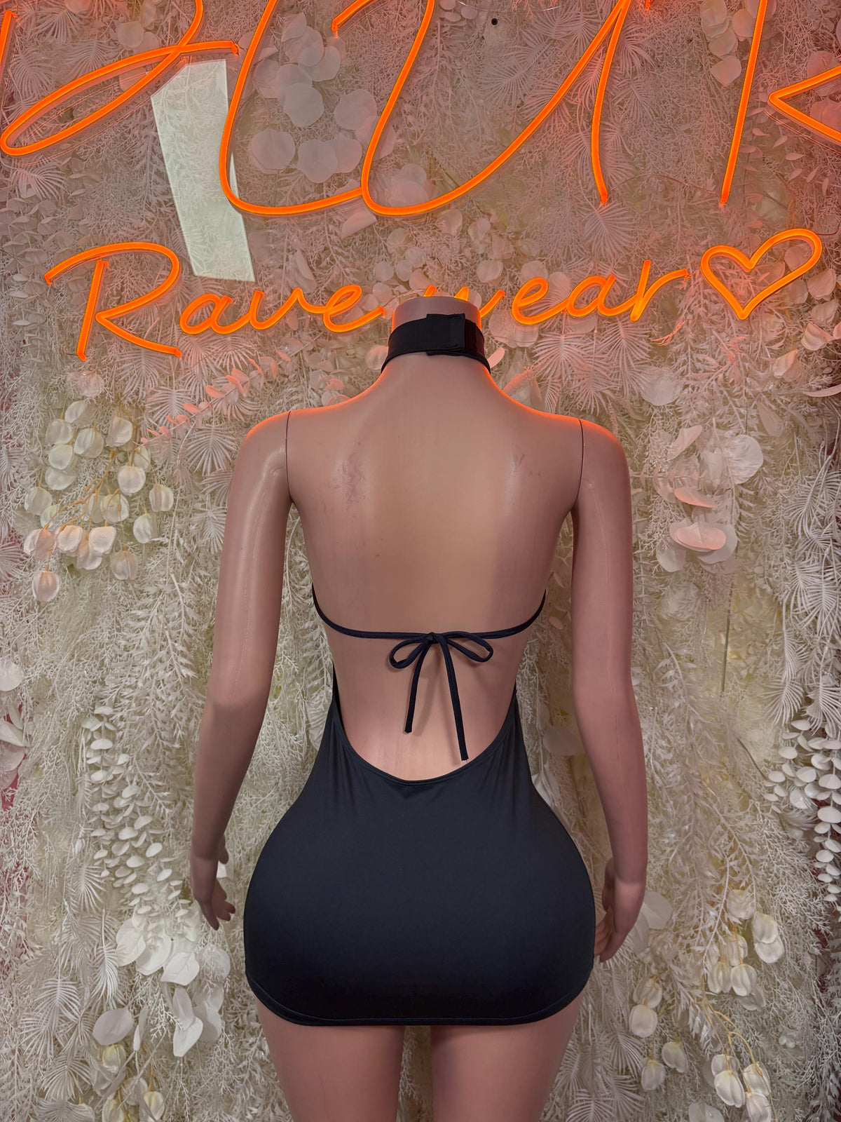 Black halter mini dress with high back lace-up tie and fitted bodycon shape