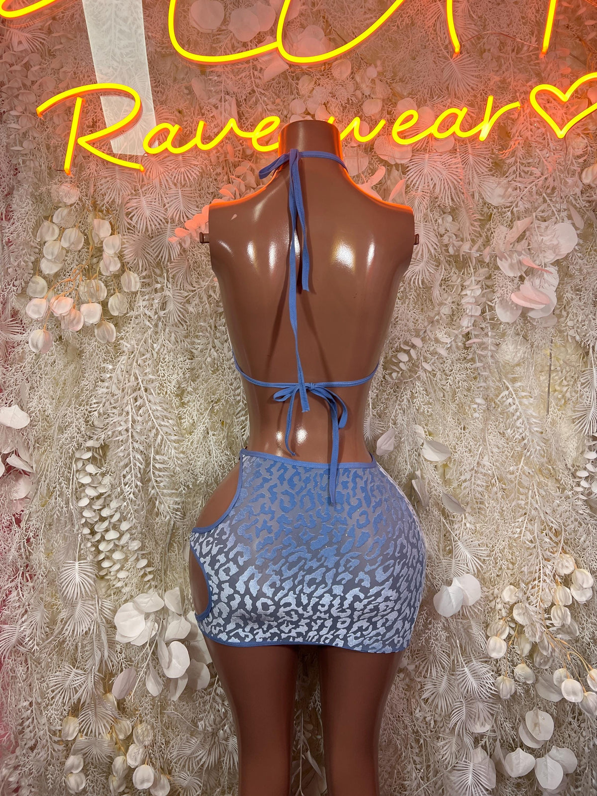 Blue leopard-print two-piece skirt set with open-back halter top and mini skirt ties
