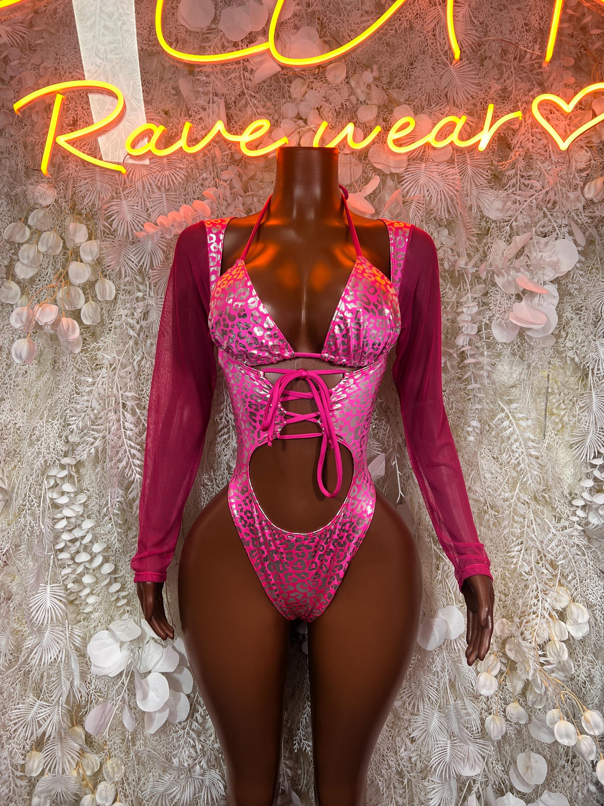 Hot pink metallic cheetah-print bodysuit with V neckline and front lace-up cutout