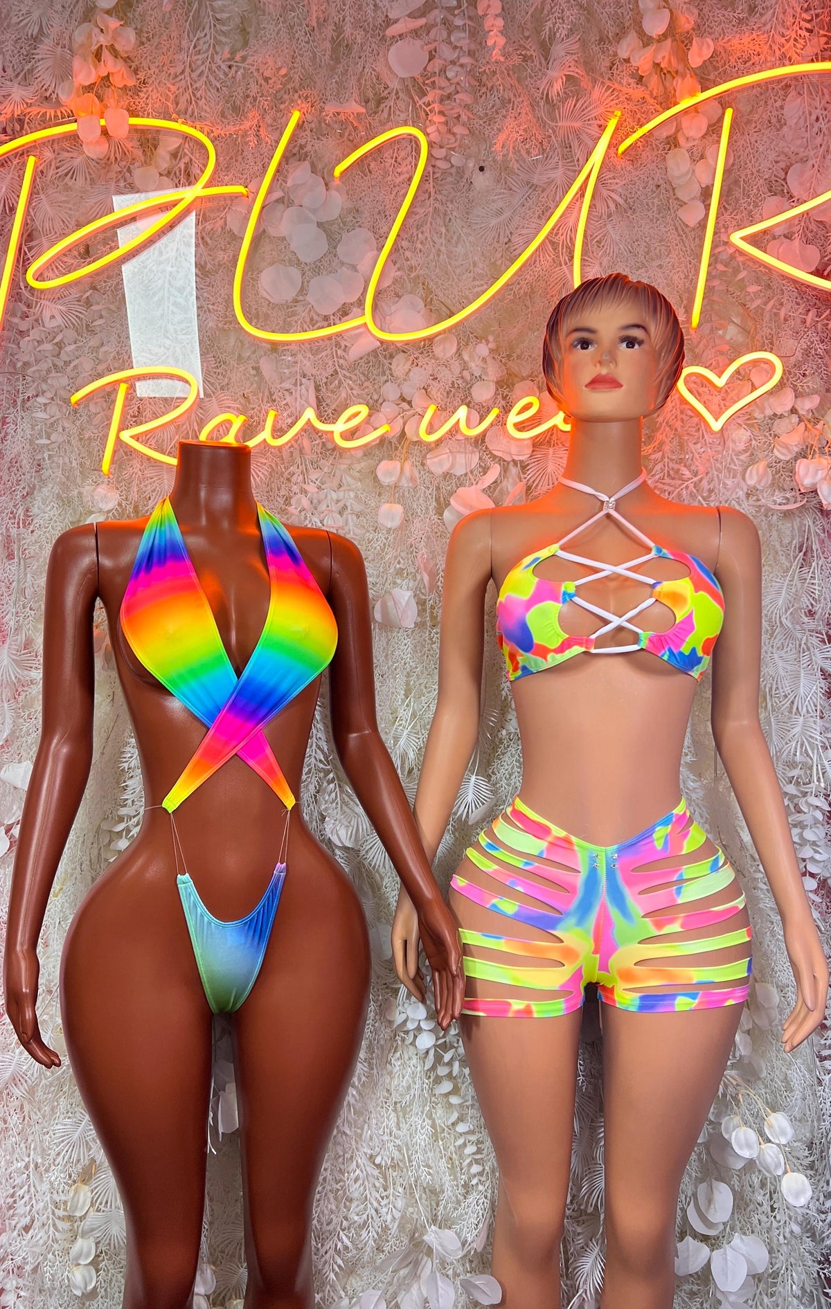 Rainbow neon bikini set, crisscross bandeau top and striped hologram shorts, two angles
