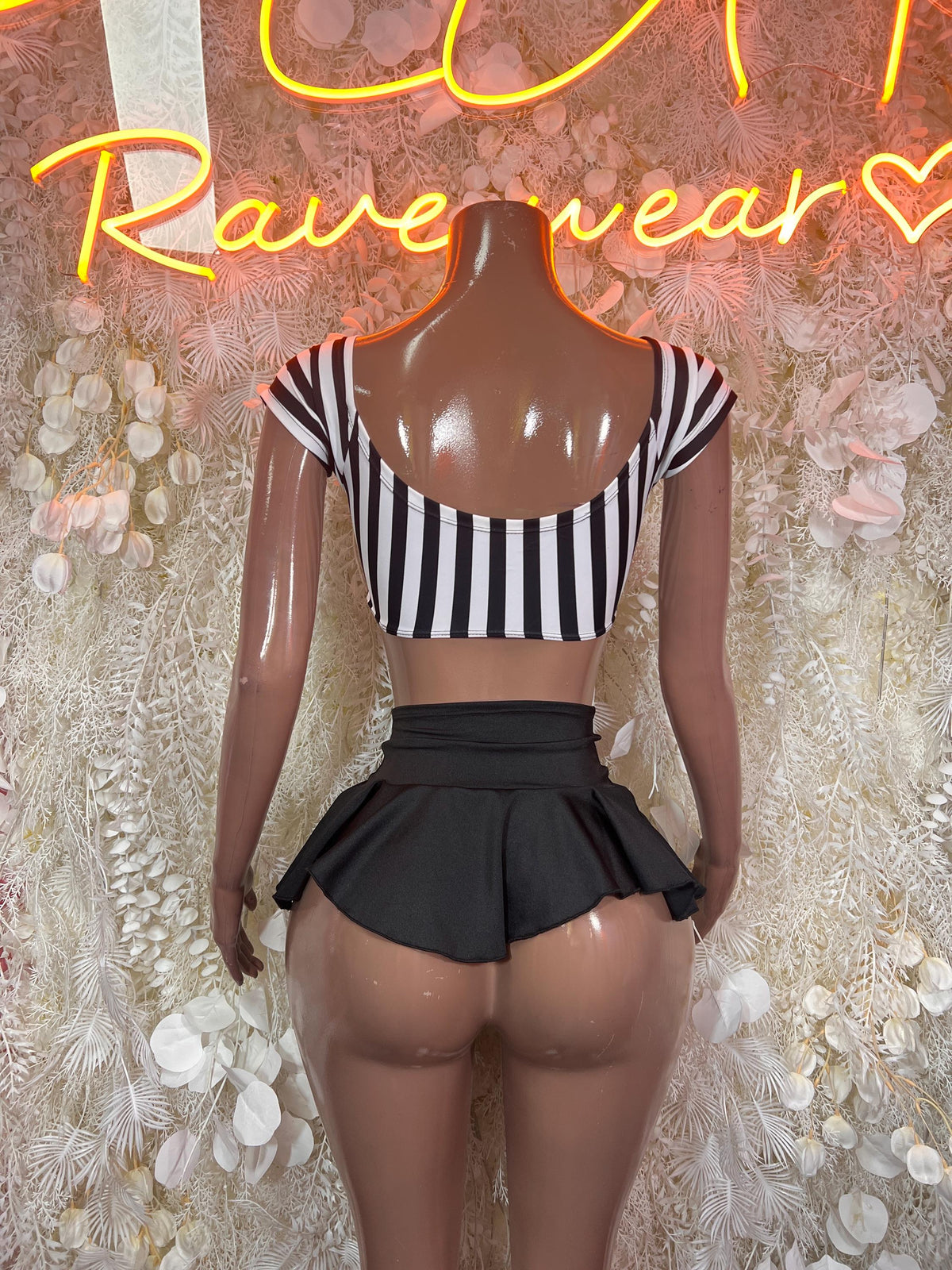 Referee two-piece outfit, back: black ruffled mini skirt and striped crop top