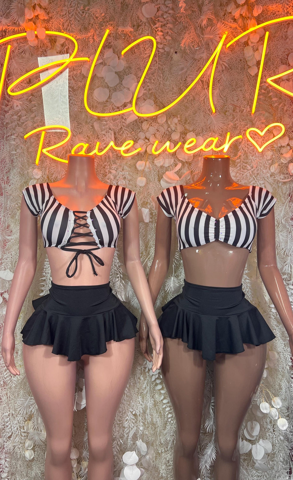 Referee two-piece outfit: lace-up striped crop top with black ruffled mini skirt, front