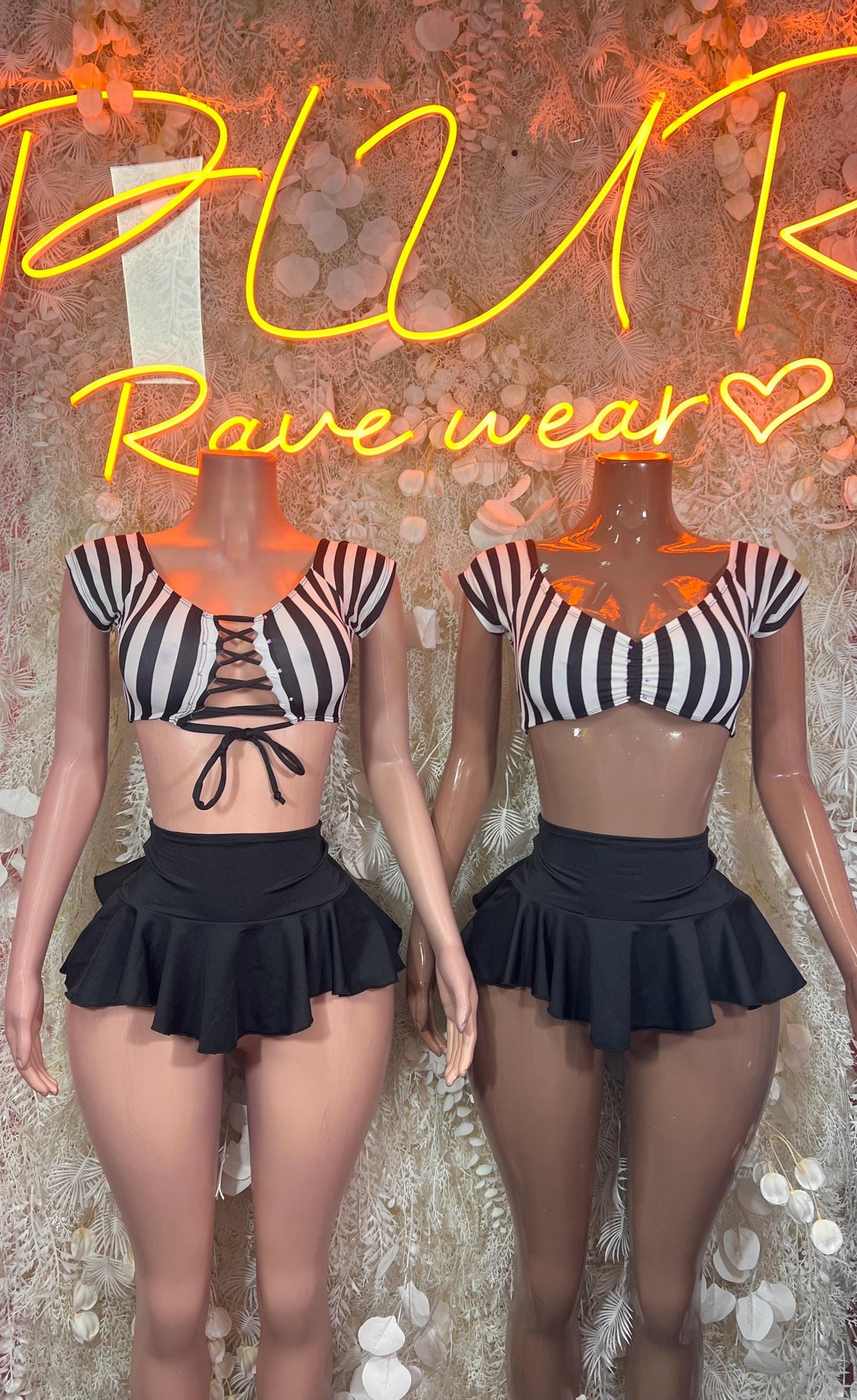 Referee two-piece outfit: lace-up striped crop top with black ruffled mini skirt, front
