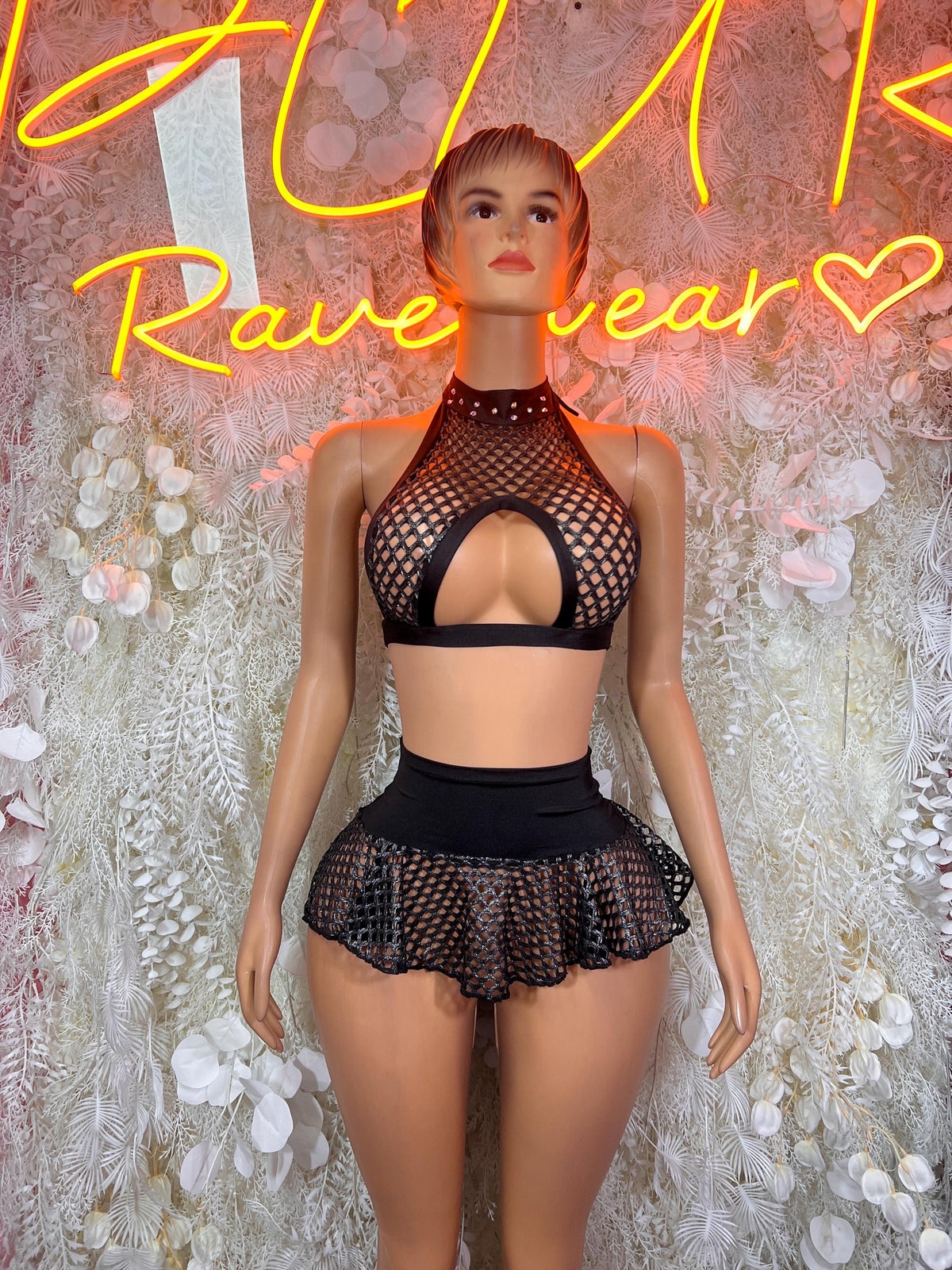 Black fishnet halter crop top with rhinestone choker and ruffle skirt festival outfit