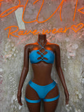 Blue metallic halter bandeau and high-cut thong set with crisscross front garters