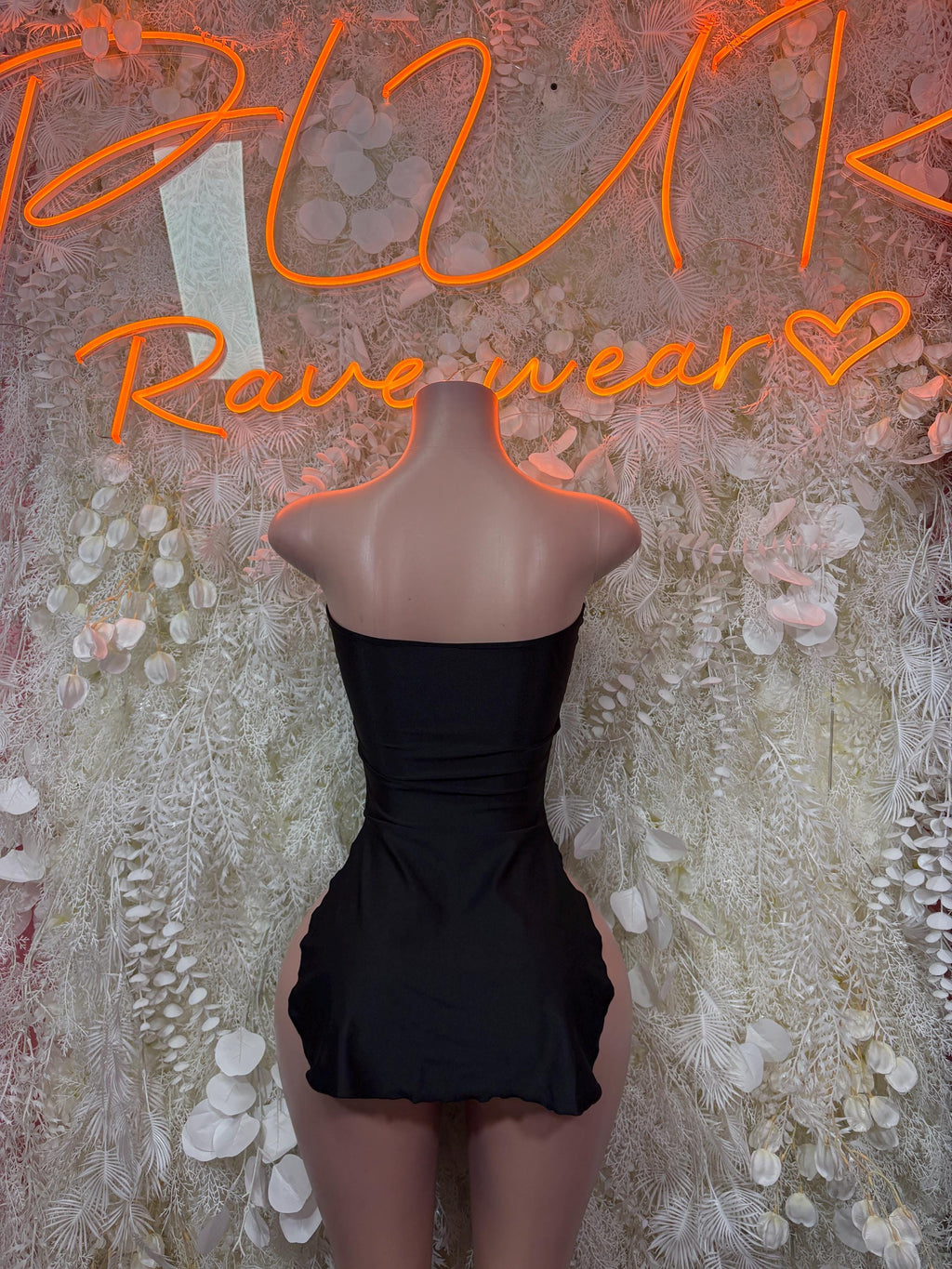 Black strapless high-cut bodysuit with open back and lace-up center