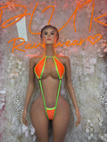 Neon orange and green cutout bodysuit with halter neck, front view