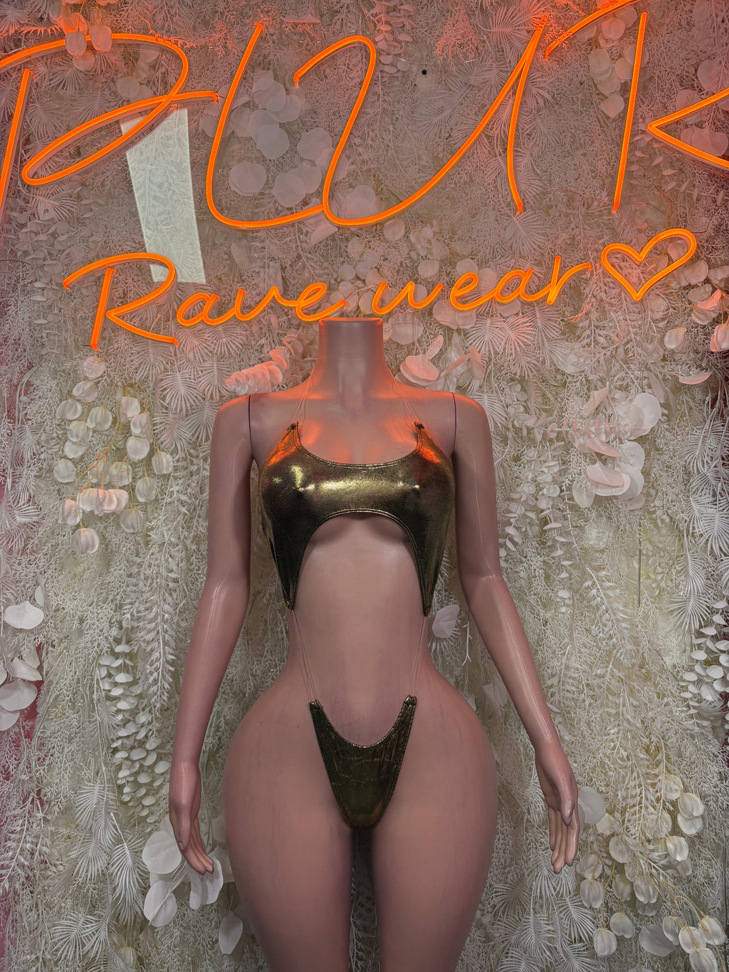 Cutout bodysuit in olive metallic, high-cut legs, thong back with central front cutout.