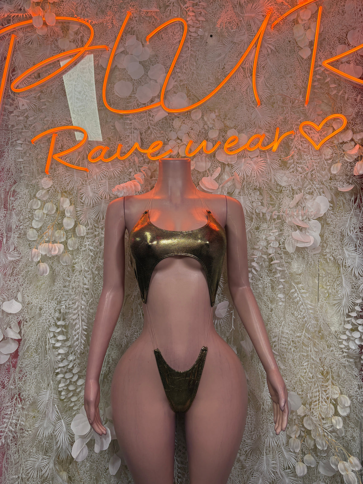 Cutout bodysuit in olive metallic, high-cut legs, thong back with central front cutout.