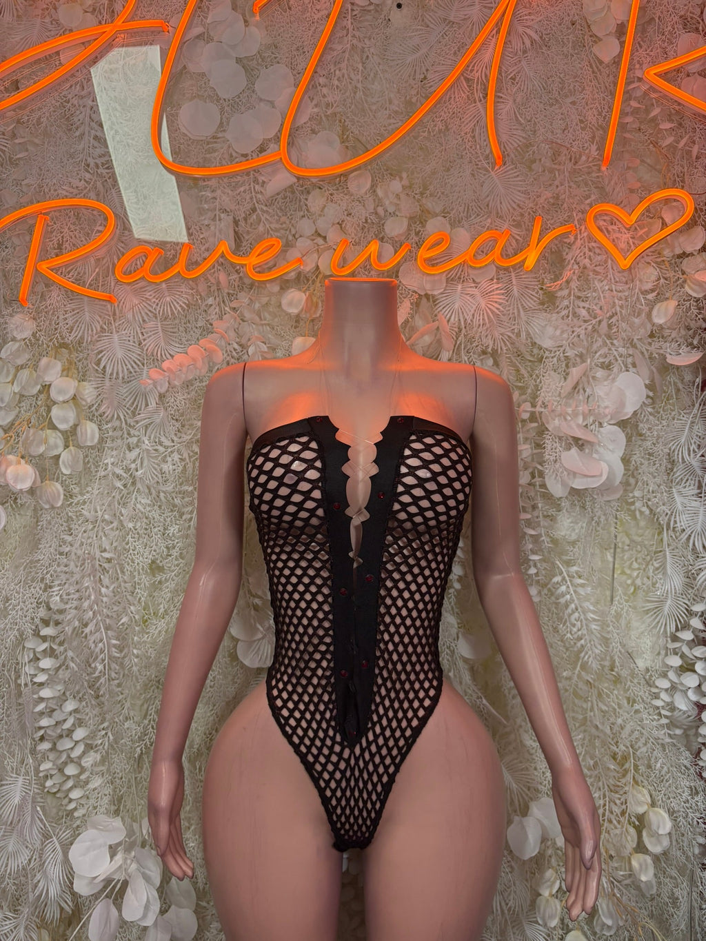 Black fishnet lace-up bodysuit with sweetheart front, open back