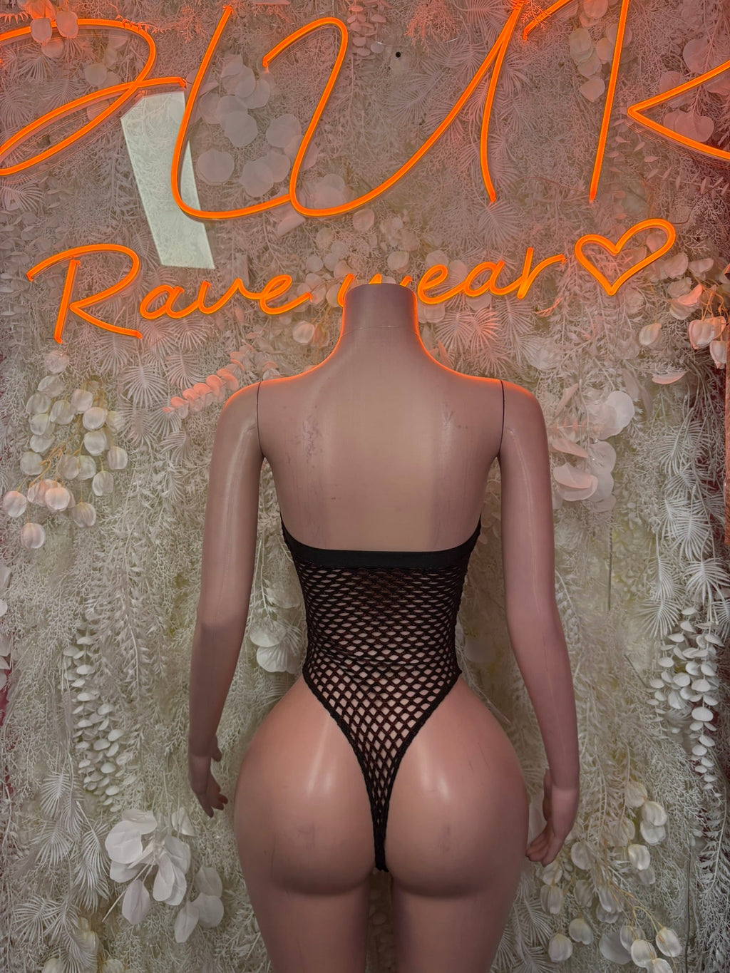 Black fishnet lace-up bodysuit, low back with vertical strap detail