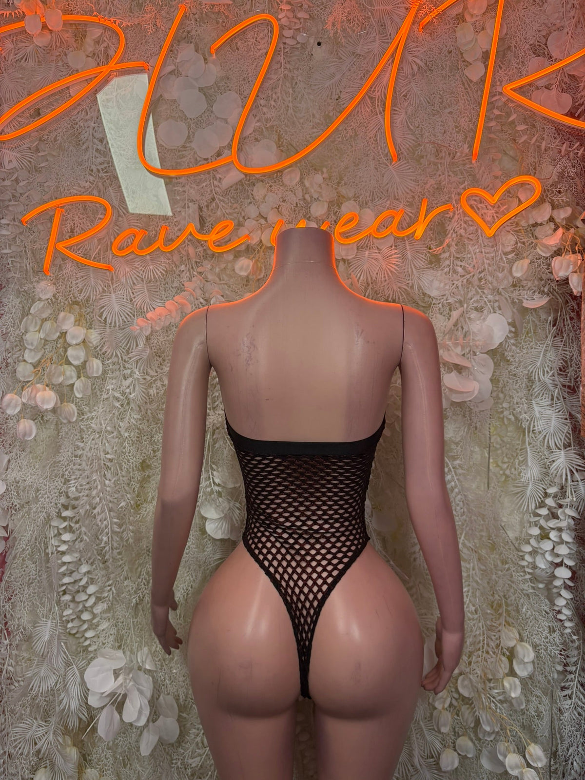 Black fishnet lace-up bodysuit, low back with vertical strap detail