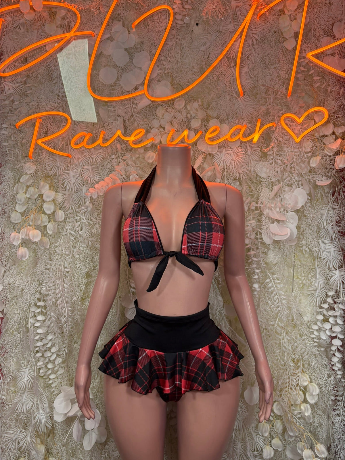 Red plaid ruffle skirt two-piece set with black bow bikini top and mini skirt