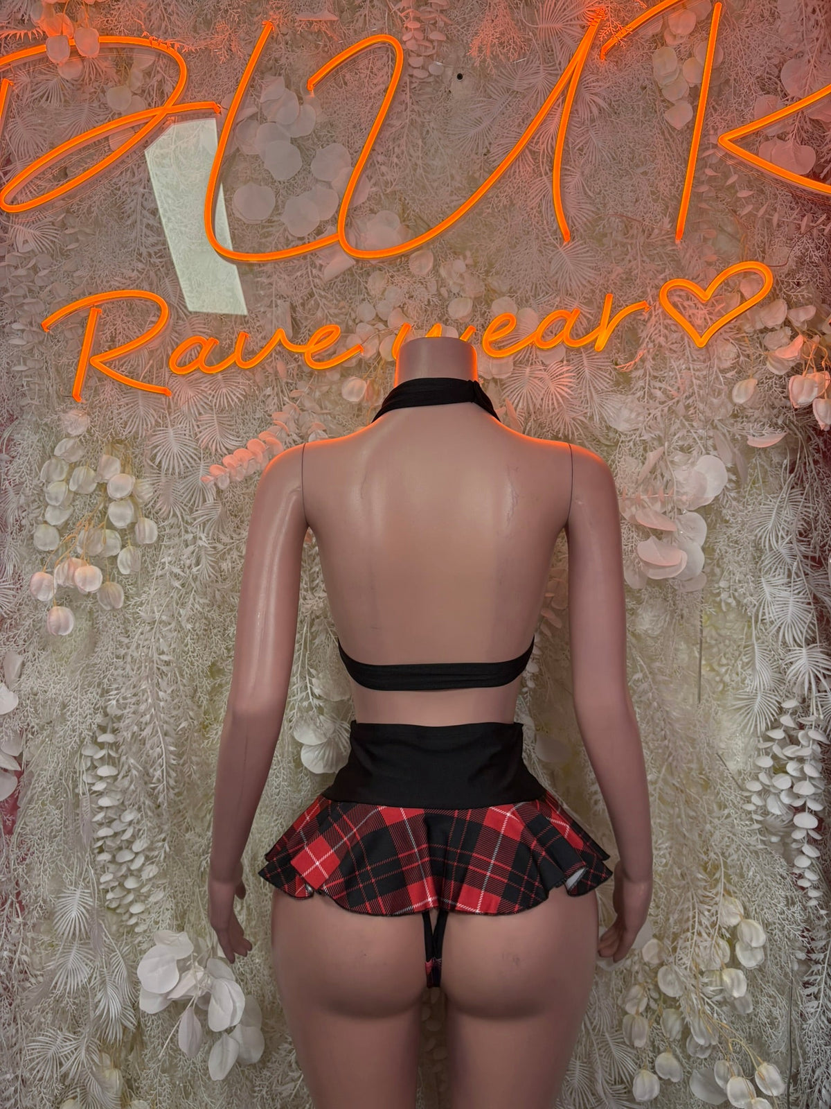 Back view red plaid ruffle mini skirt with black strap bikini top