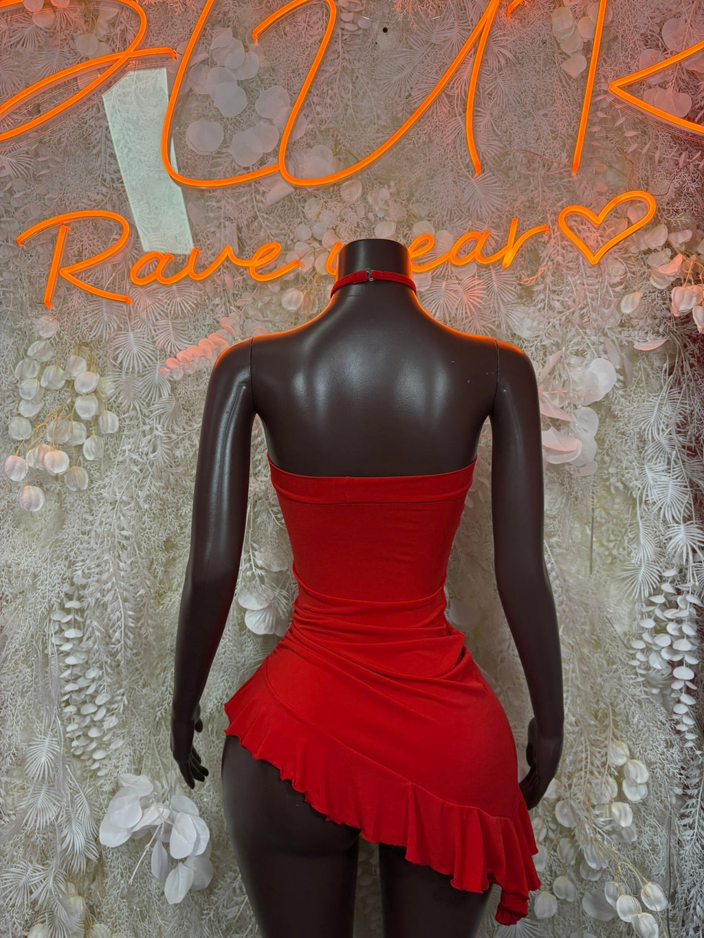 Red strapless ruched mini dress with fitted back and ruffled mini skirt hem