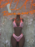 Pink lace triangle bikini set with halter top and high-rise tie side bottoms