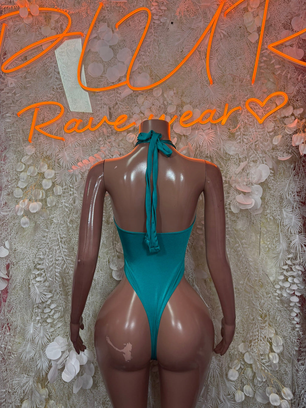 Teal bodysuit with open back and halter ties forming V shape