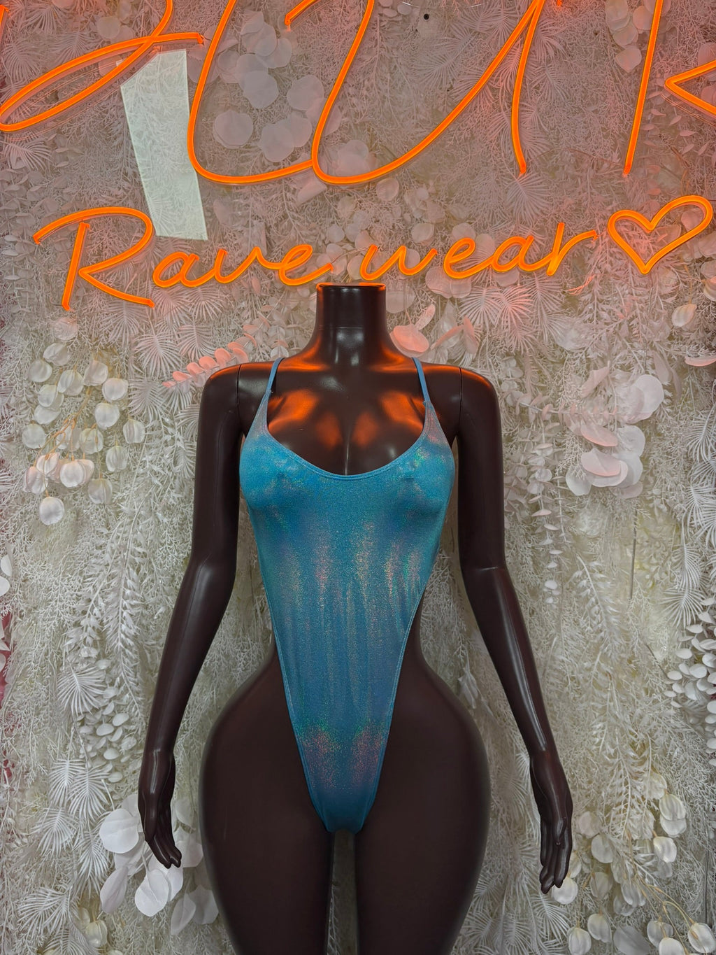 Blue ombre strappy one-piece bodysuit with scoop neckline on a mannequin