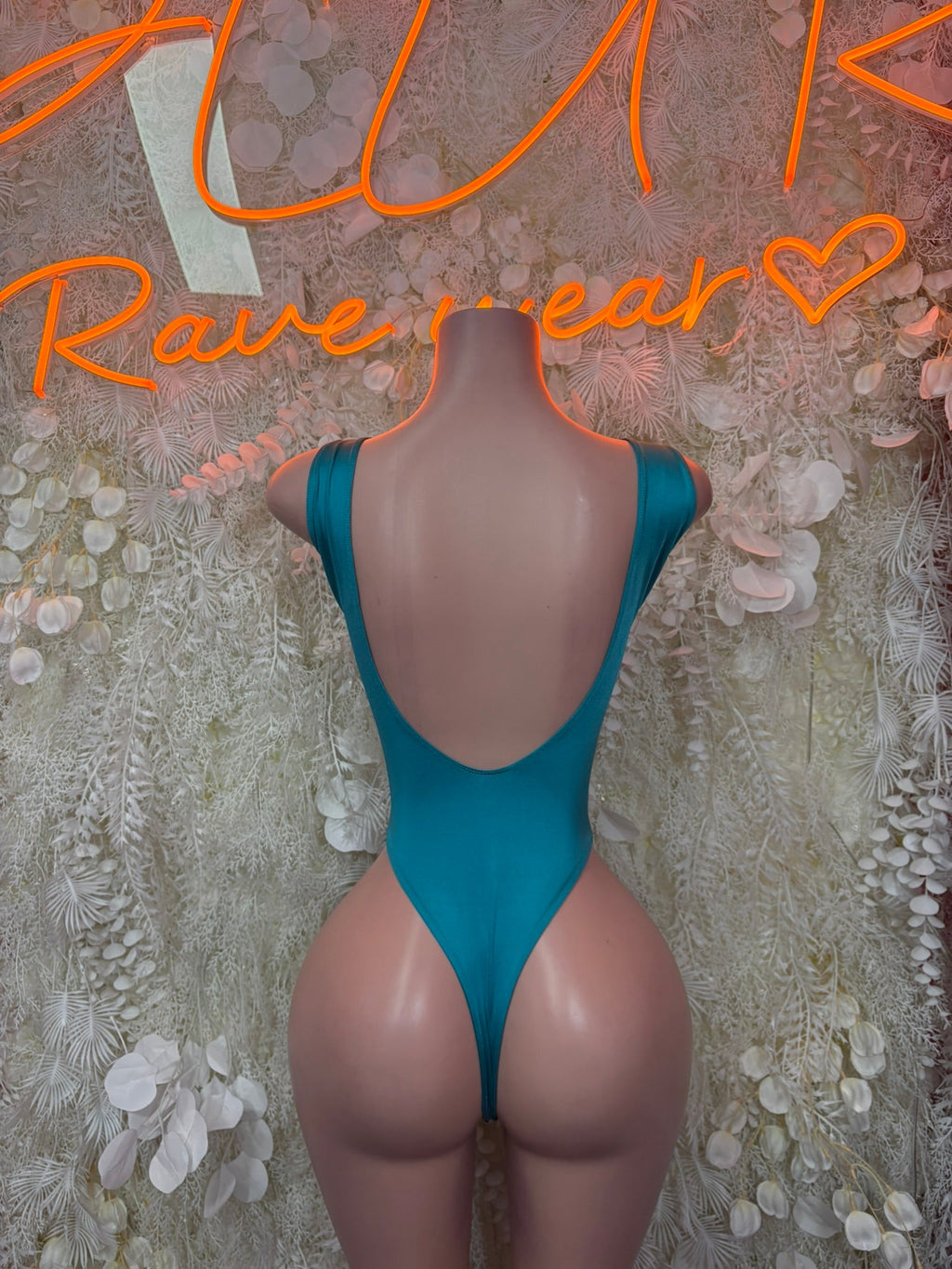 Teal glitter bodysuit with deep V-back and high-cut leg openings