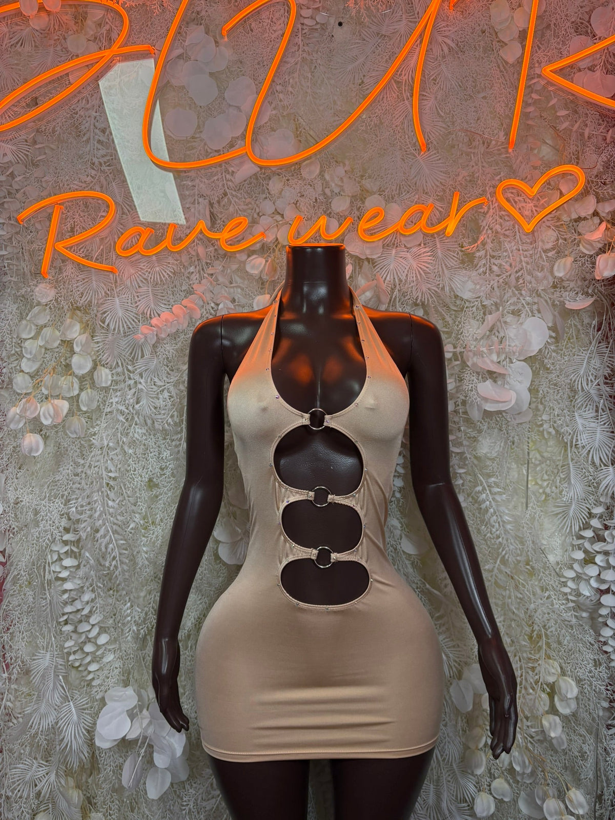 Nude mini dress with triple cutout chest detail and ring hardware