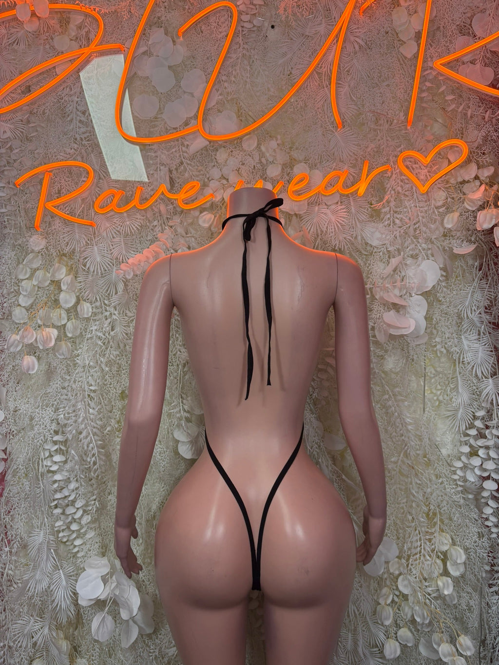 Black halter thong bodysuit with long tie strings and open back cutout