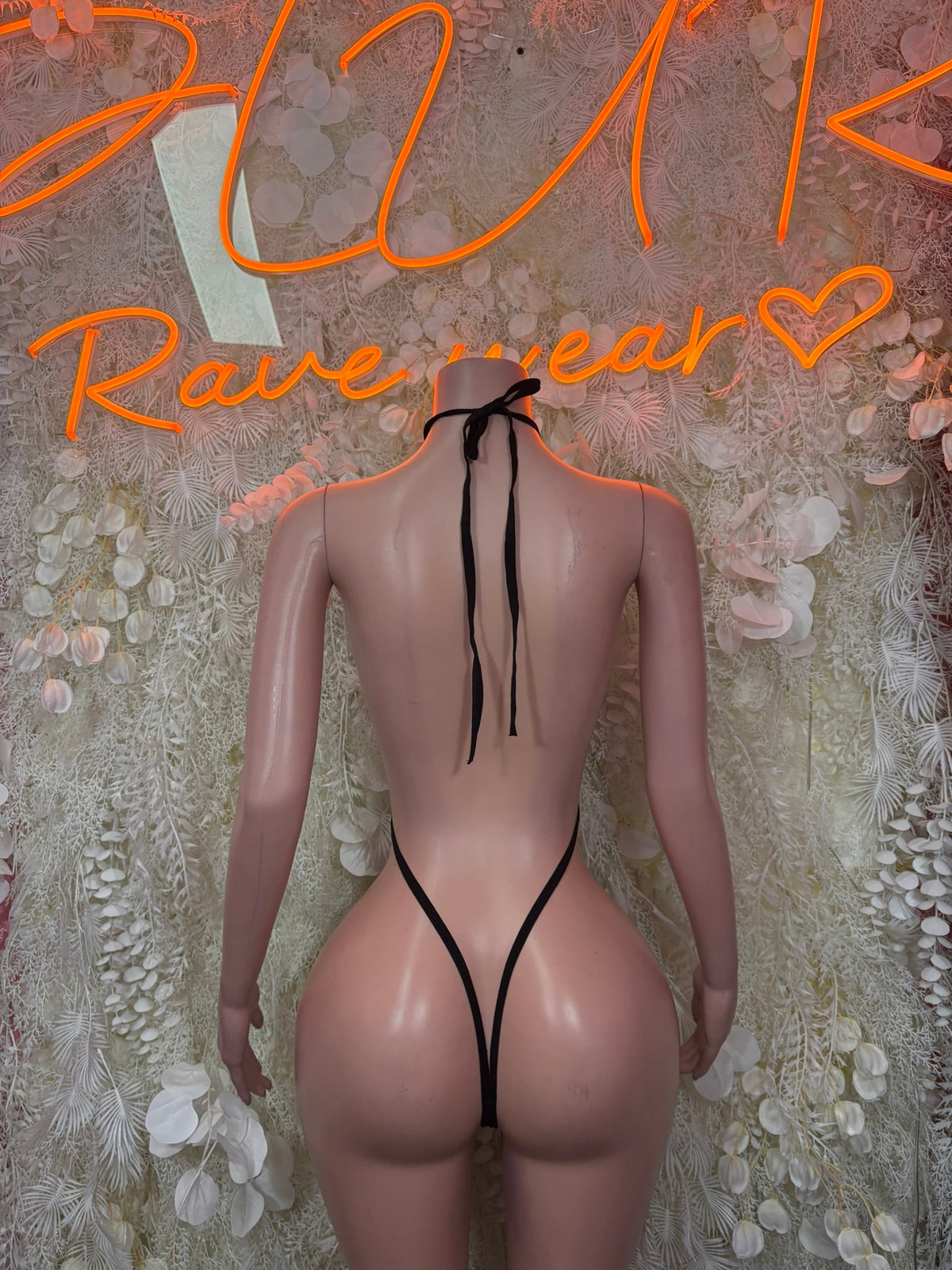 Black halter thong bodysuit with long tie strings and open back cutout