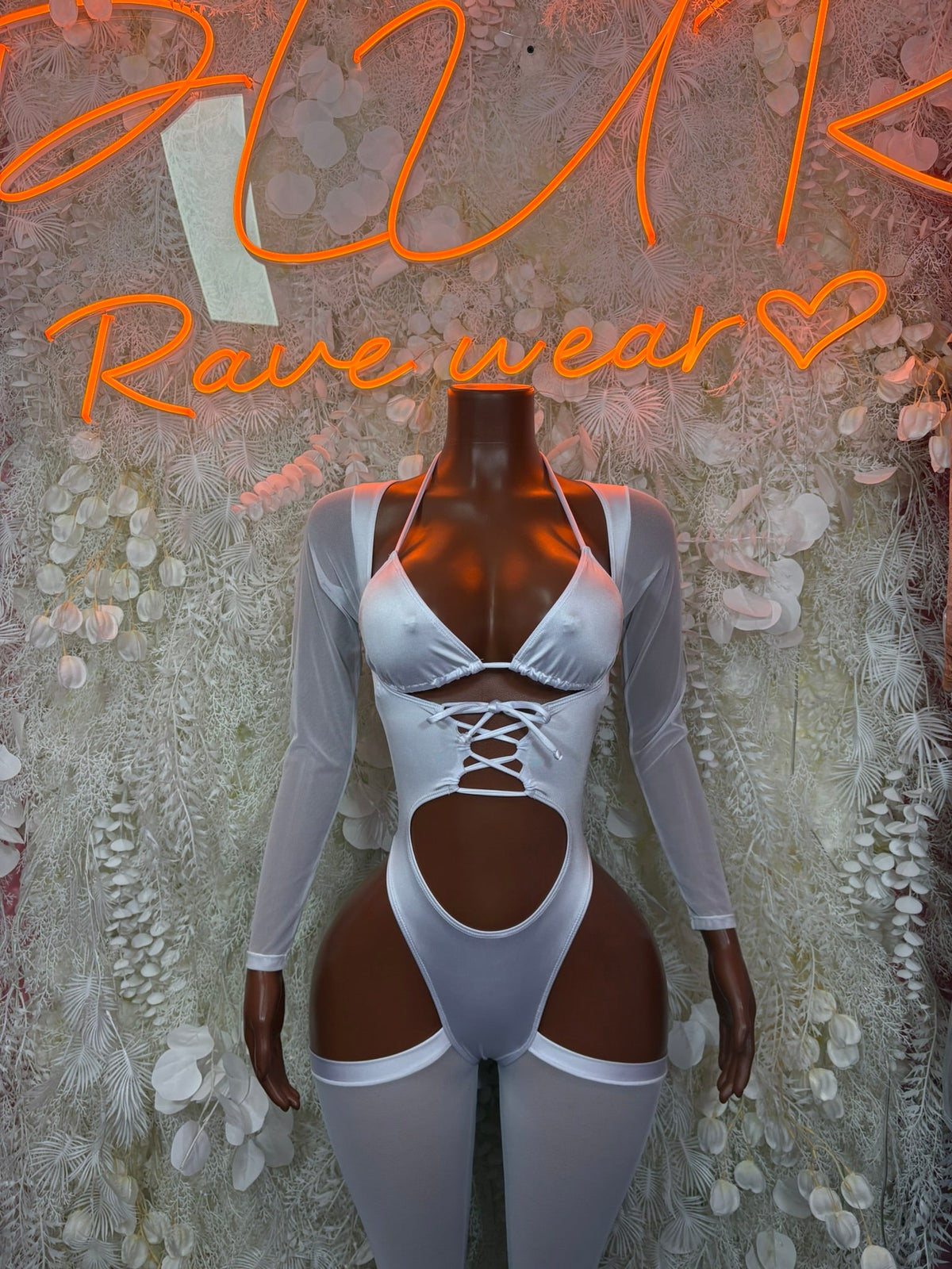 Light blue long-sleeve cutout bodysuit with crisscross chest and midriff cutouts