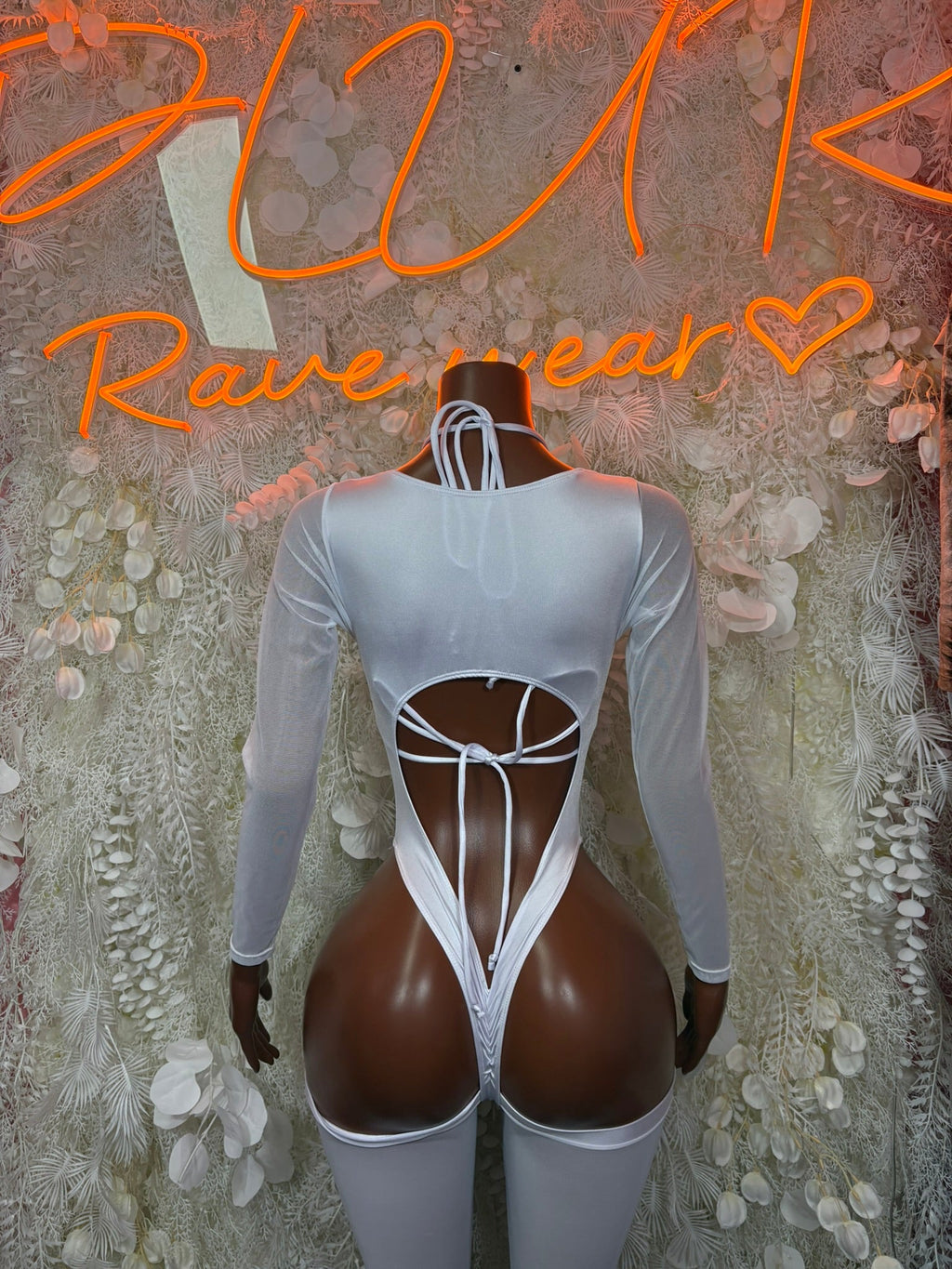 Light blue long-sleeve cutout bodysuit with open-back crisscross straps