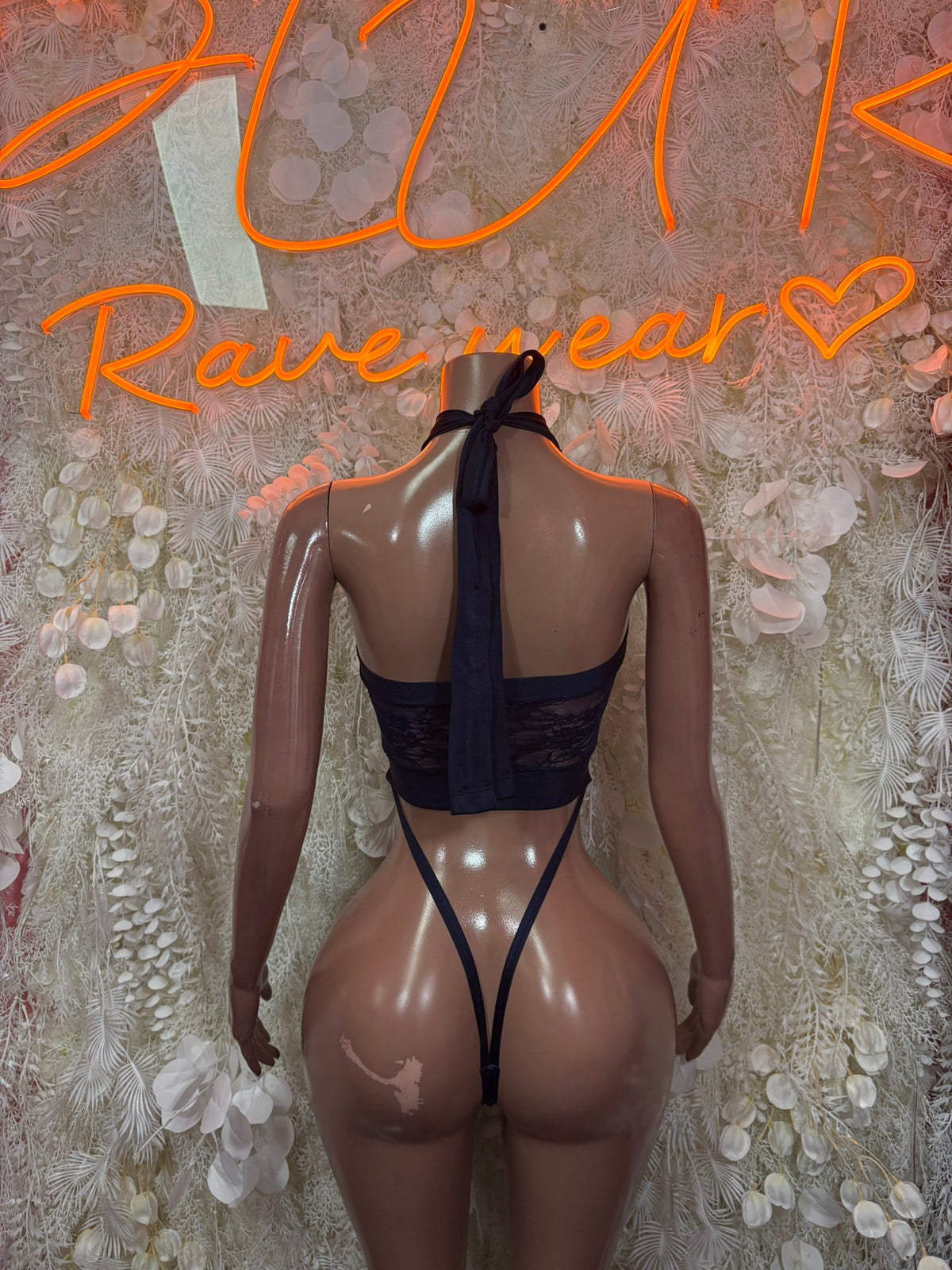 Black lace halter micro bodysuit back view with tie straps and thong cut