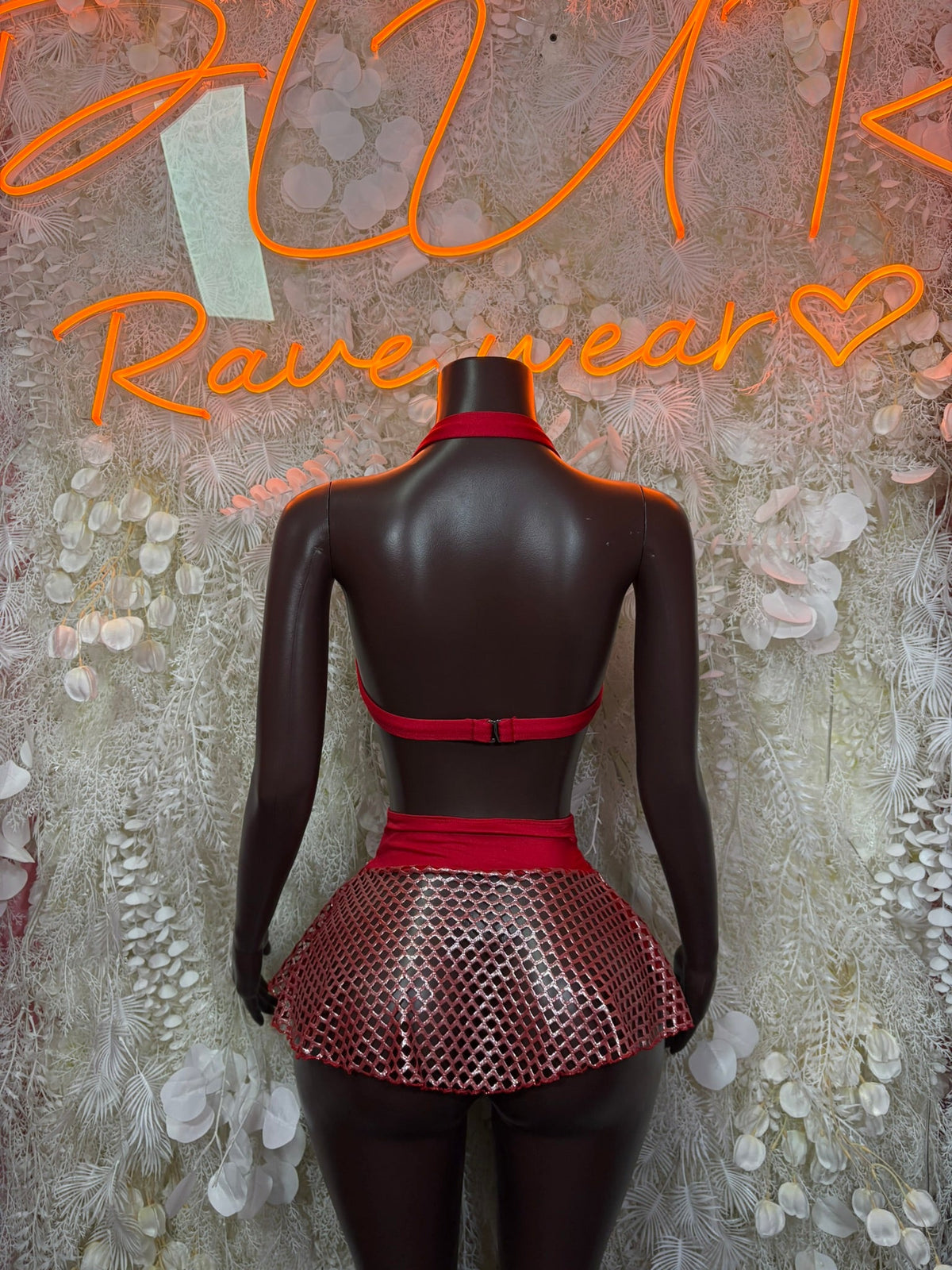 Red/black fishnet halter mini skirt set, back view with halter straps and flared mini skirt.