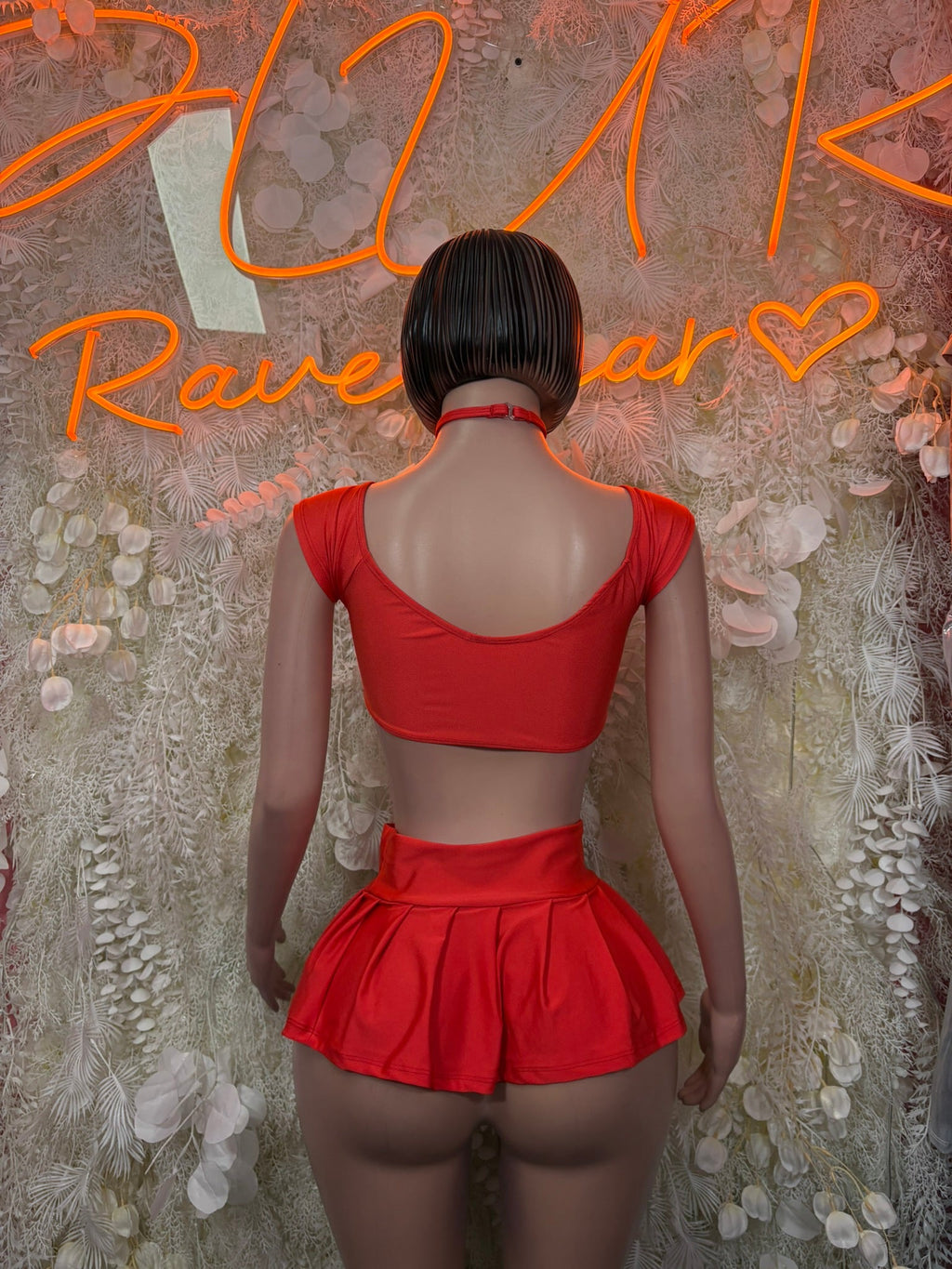 Red short-sleeve crop top and ruffled mini skirt set, back view