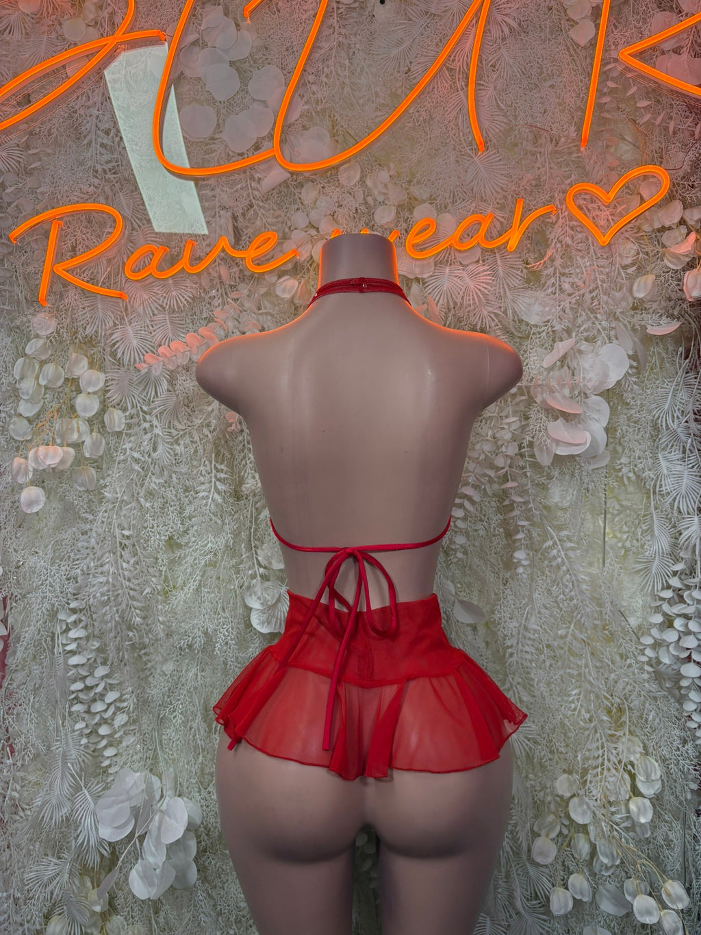 Red halter bikini top with ruffle skirt overlay, back view