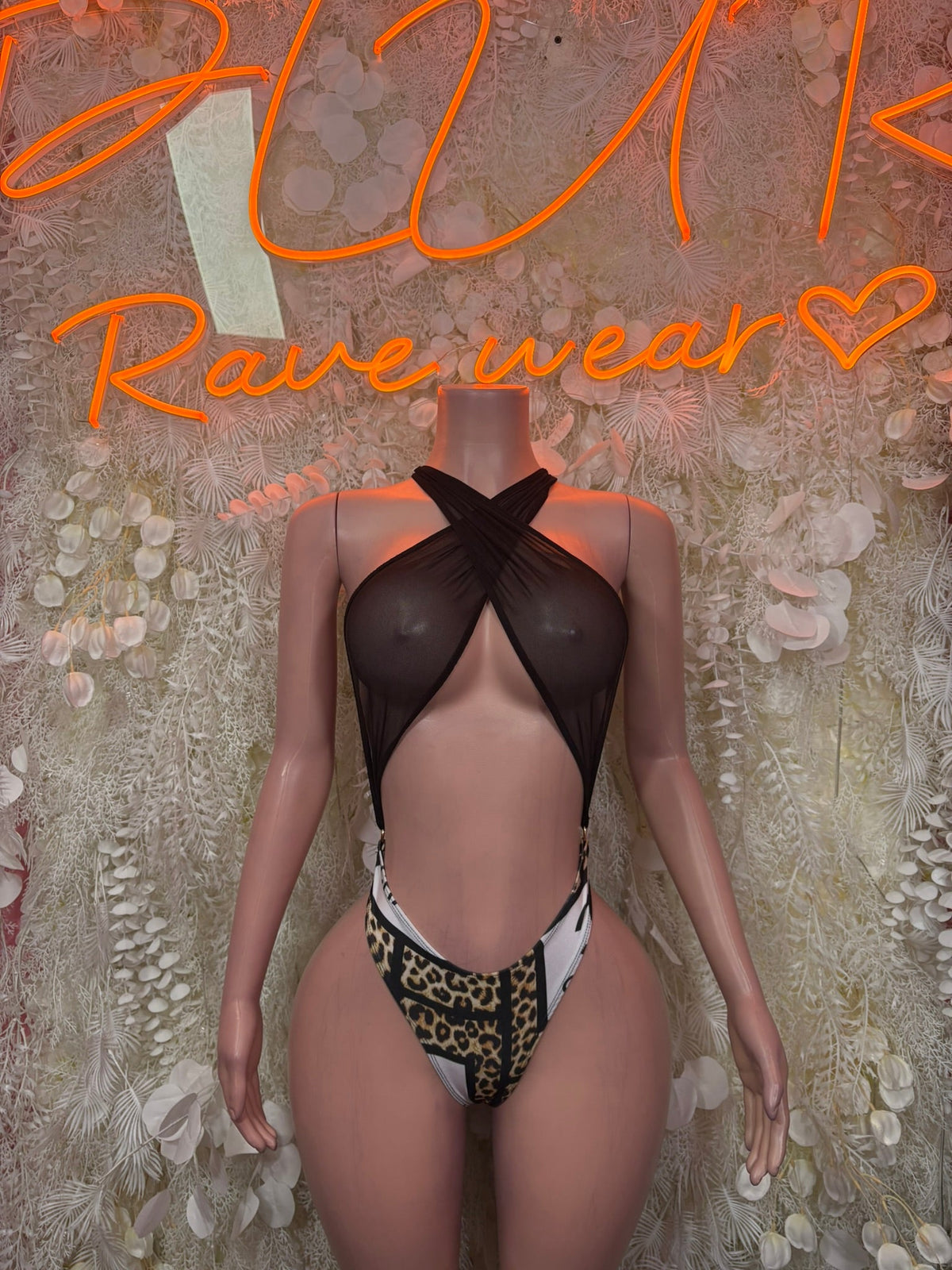 Black halter one-piece dancewear with leopard print sides and chest cutout, black mesh panel
