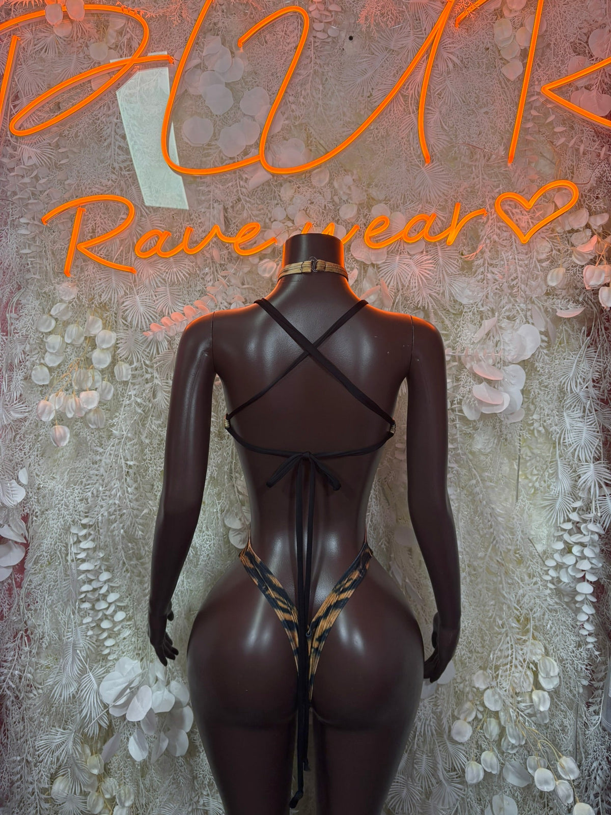 Sheer long-sleeve bodysuit with crisscross open back and high-cut bottom