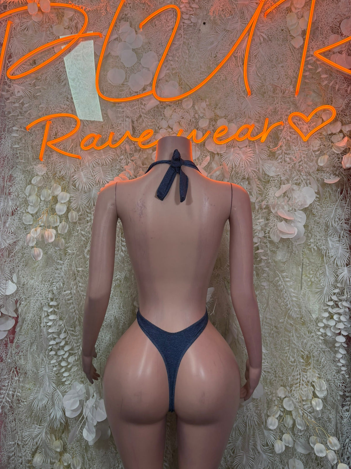 Navy plunging bodysuit with tie-back straps and open back