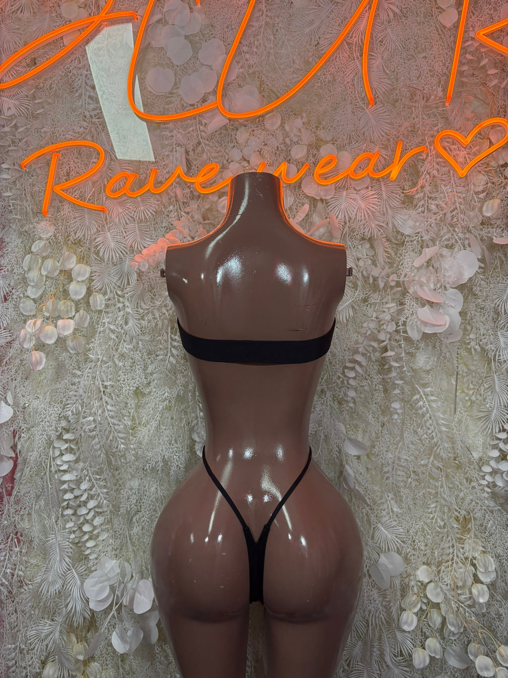 Black sheer mesh one-piece bodysuit with straight neckline and thong-style cut