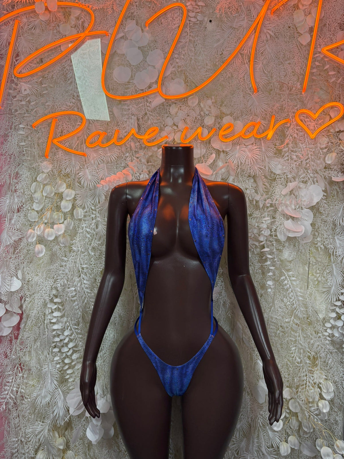 Royal blue plunge slingshot bodysuit with V-neck and high-cut coverage