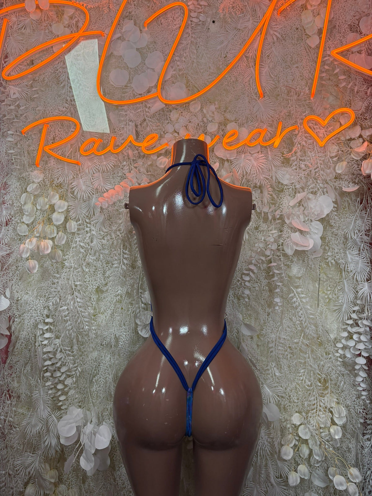 Royal blue glitter halter bodysuit back view with crisscross straps and tie-back
