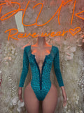 Teal glitter bodysuit with deep V plunge, long sleeves, black leopard print