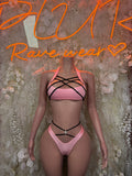 Pink strappy cutout bodysuit with crisscross bands and high-cut bottom