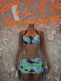 Two-piece festival outfit: halter bikini top and mini skirt, colorful graphic print