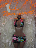 Floral mini skirt set with black halter top and draped tie detail