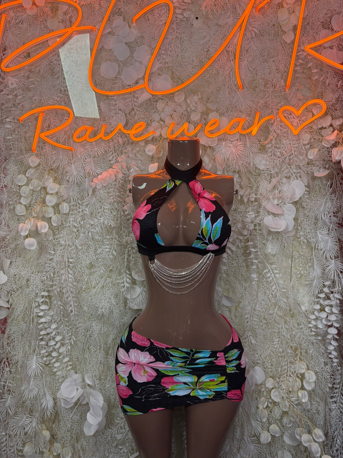 Floral mini skirt set with black halter top and draped tie detail