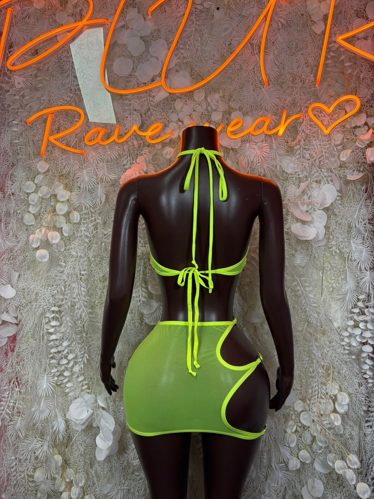 Neon green cutout mini dress set, open back with string ties on mannequin