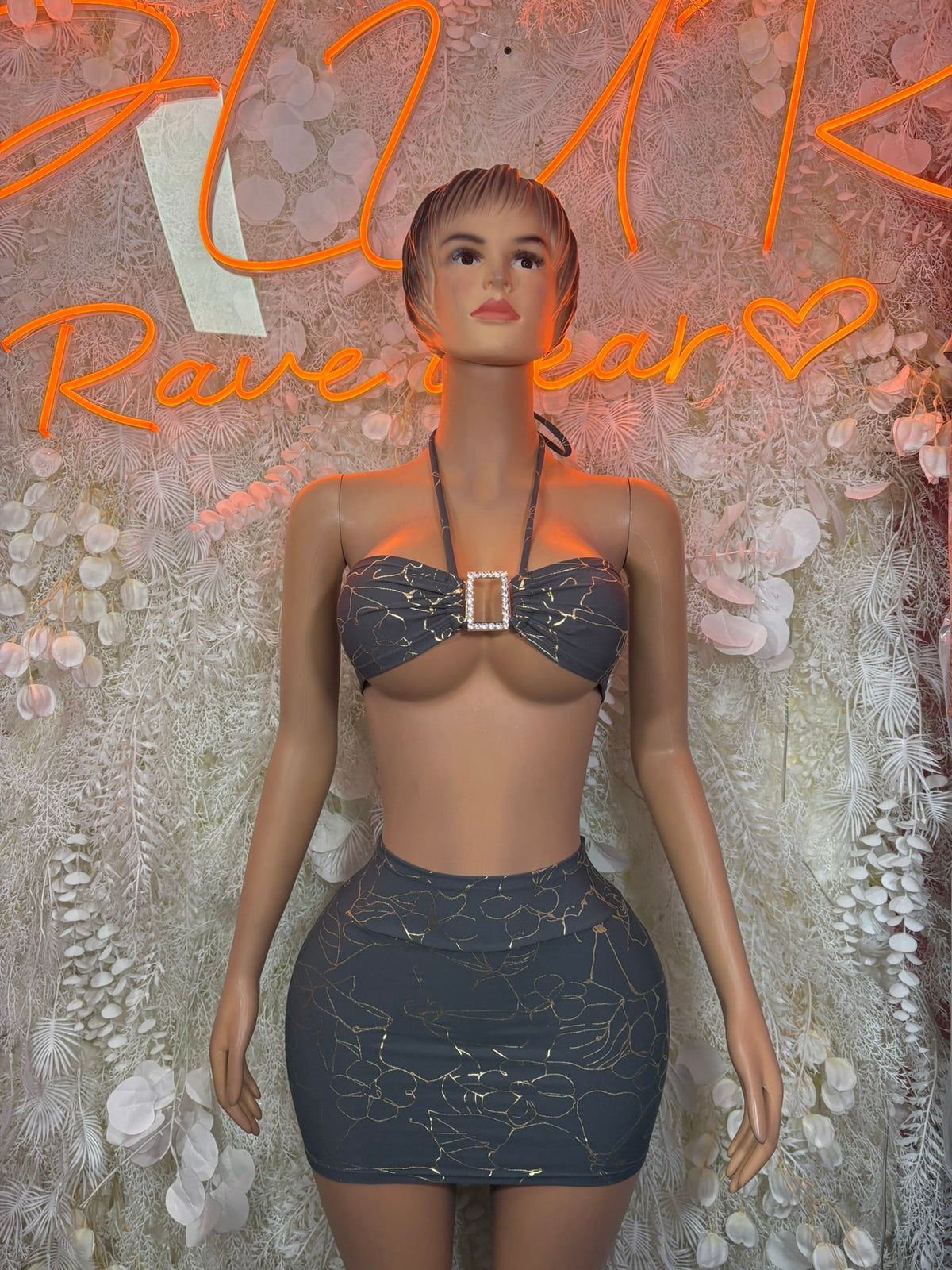 Charcoal lace bra with front buckle and matching mini skirt, front view