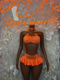 Orange textured bandeau top and ruffle mini skirt set, front view