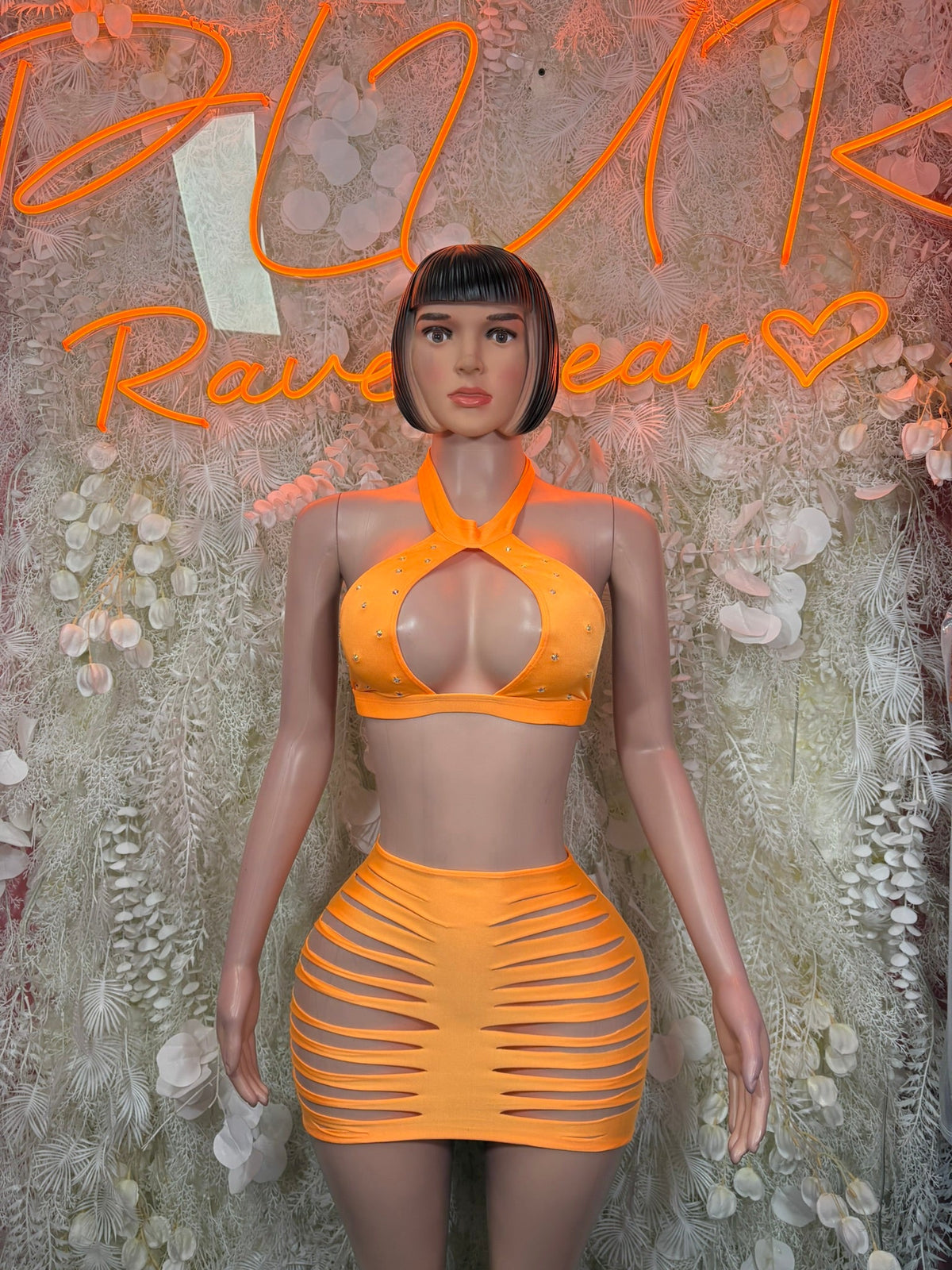 Orange cutout halter crop top and slashed mini skirt set, front view