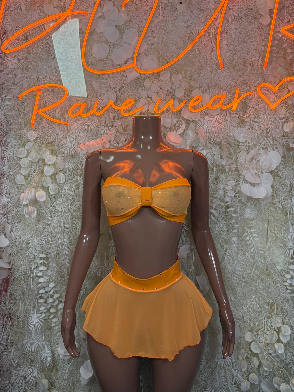 Peach sheer ruffle bikini set with bandeau top and bow front, mini skirt