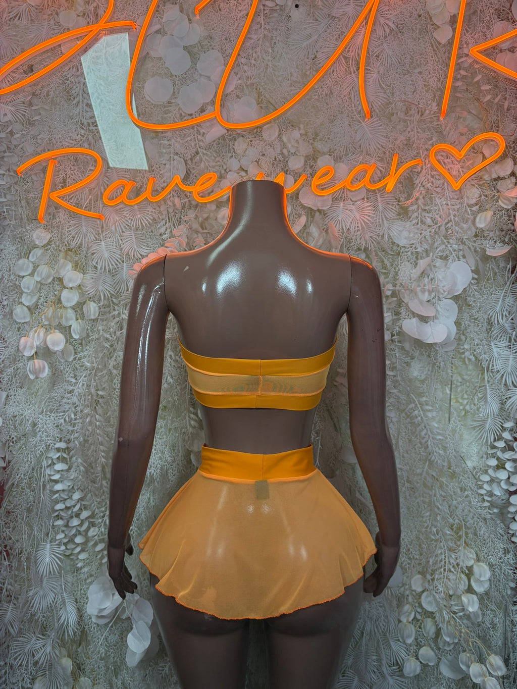 Peach sheer ruffle mini skirt and bandeau bikini back with layered straps