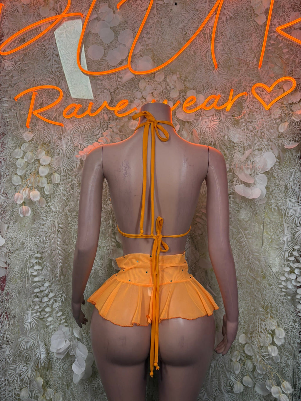 Orange halter backless ruffle top with tie straps and matching mini skirt
